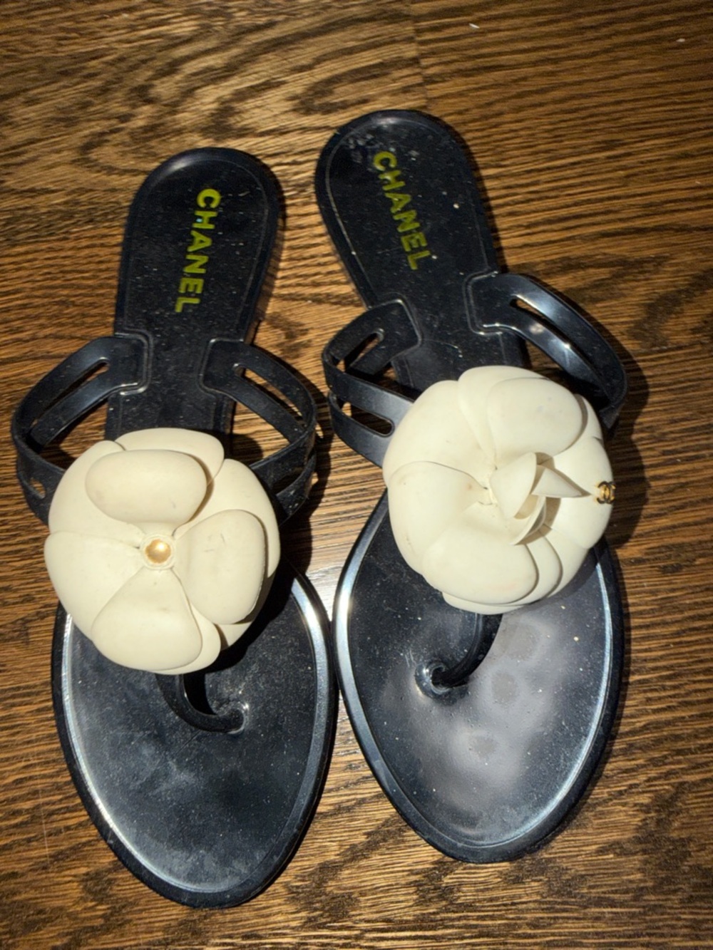 CHANEL Black Jelly Sandals with Cream Camellia Accent